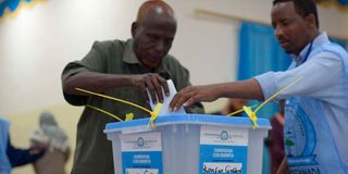 A man votes in a past election in Somalia.